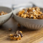 A piece of moose munch dripping with chocolate.