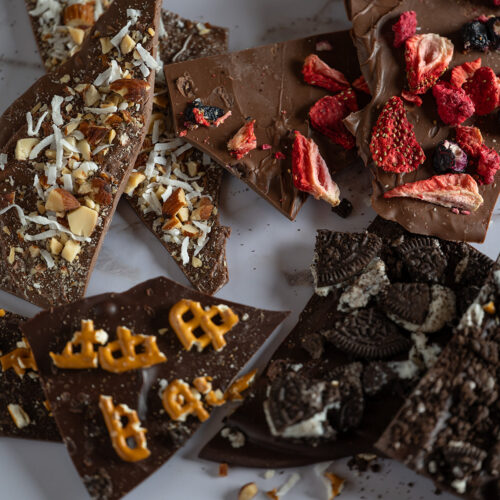 Shards of different flavors of chocolate bark.