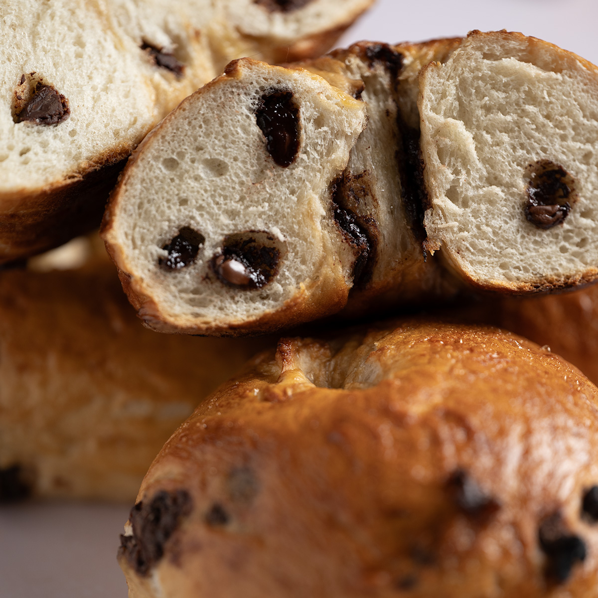 Chocolaty cross section of a chocolate chip bagel.