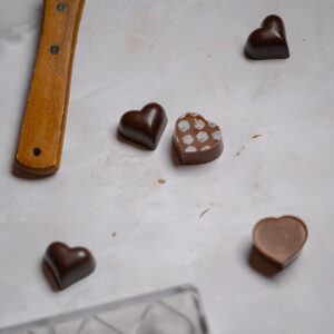 Unmolding chocolate hearts.