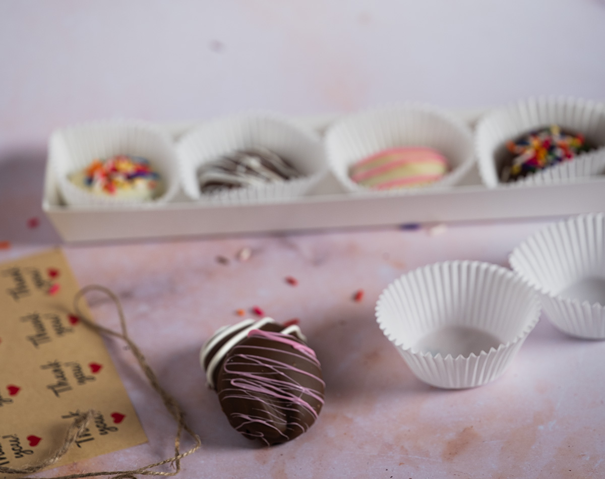 Packaging chocolate-covered Oreos as gifts.