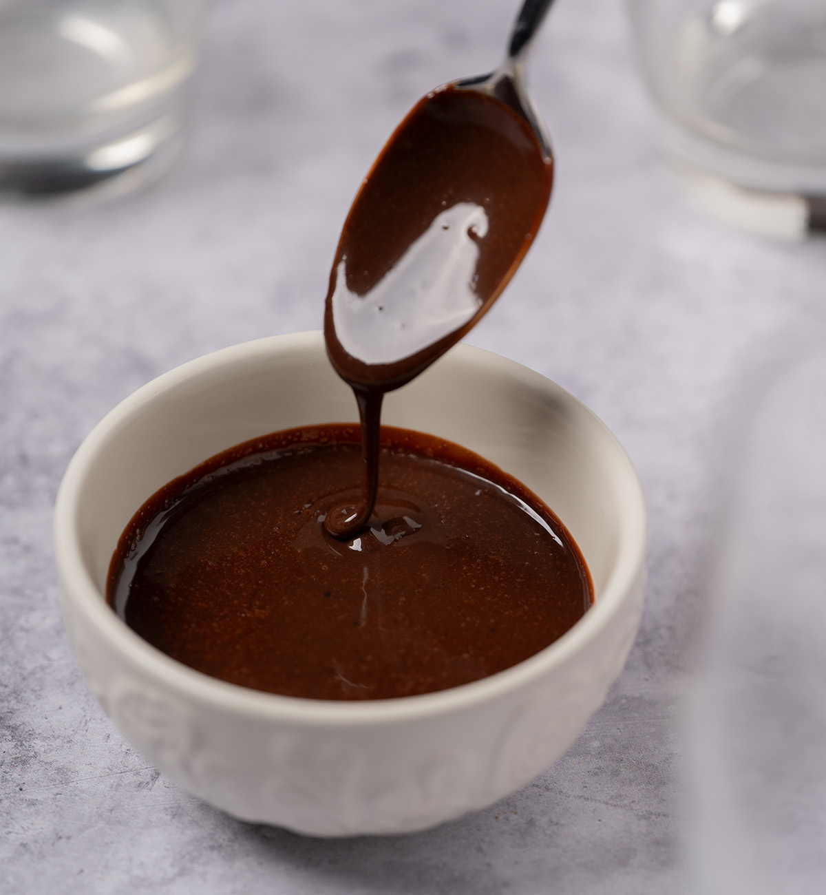 Pourable, glossy chocolate syrup.