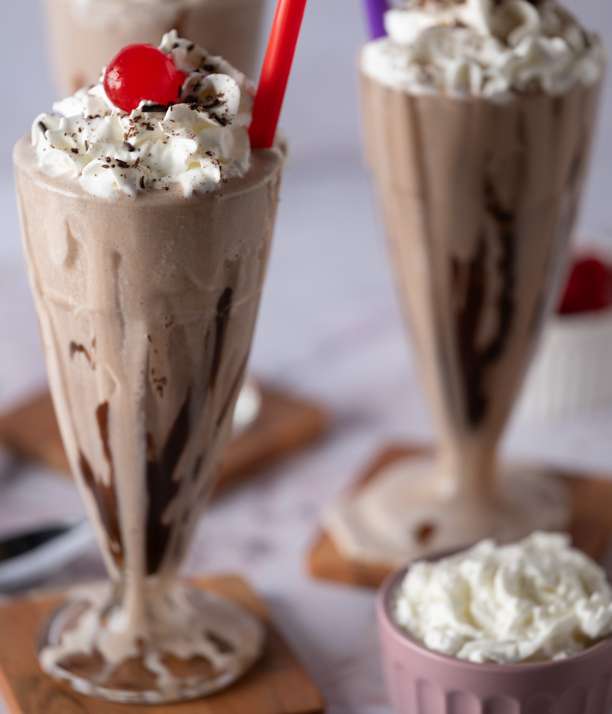 A thick, dripping chocolate milkshake.