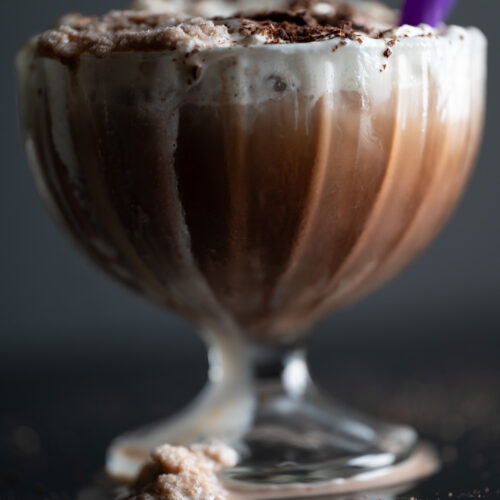 A dribble of frozen hot chocolate dripping down the side of the glass.