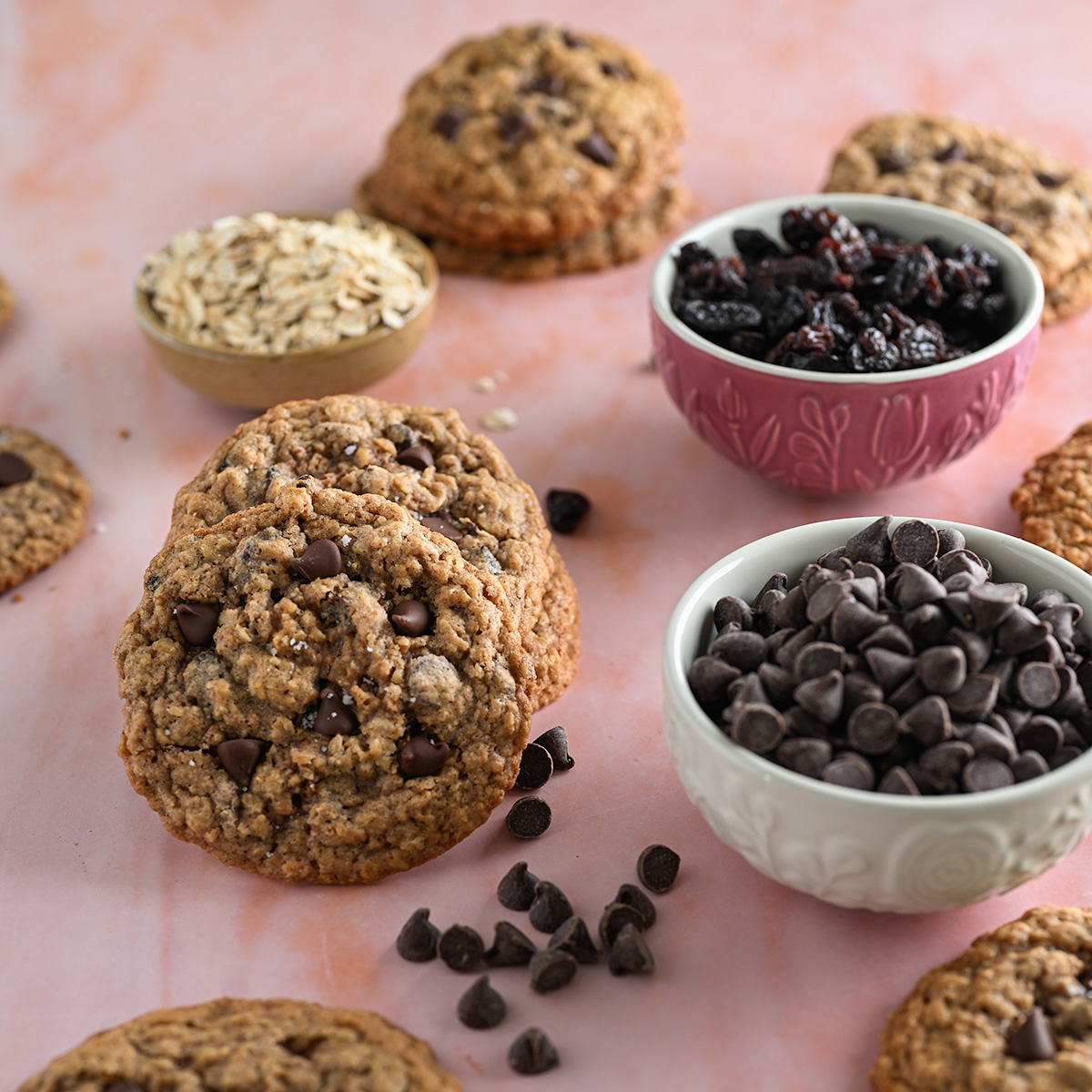 Stacks of chocolate chip oatmeal raisin cookies.
