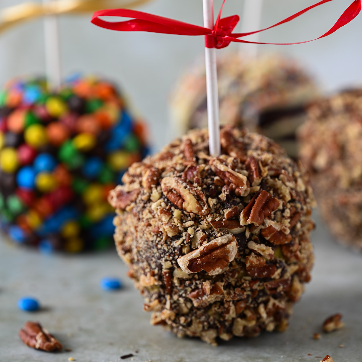 A group of chocolate caramel apples.