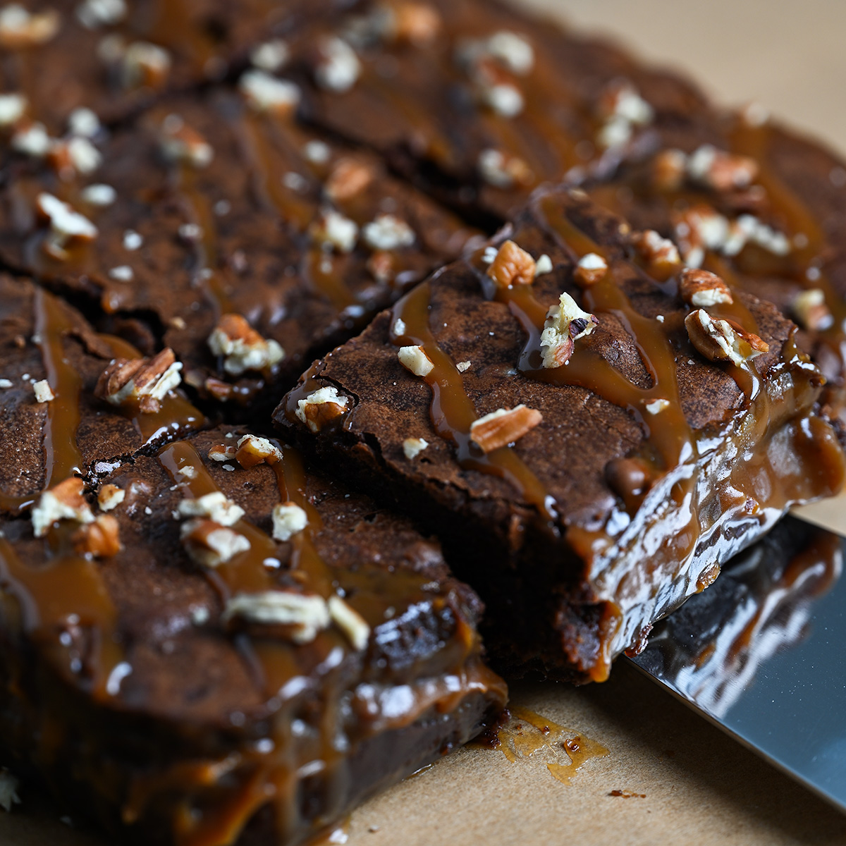 Cutting and serving turtle brownies.