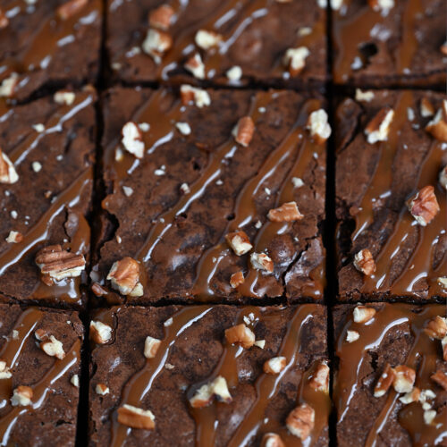 Cutting into a tray of freshly-baked turtle brownies.